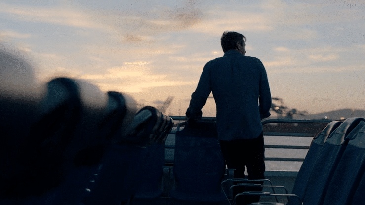 Doug Aitken on a boat at sunset